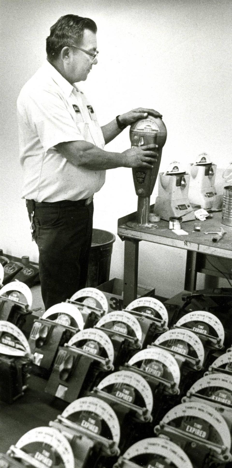 Frank Espionosa reconditions a San Luis Obispo parking meter. Photo published July 2, 1987.