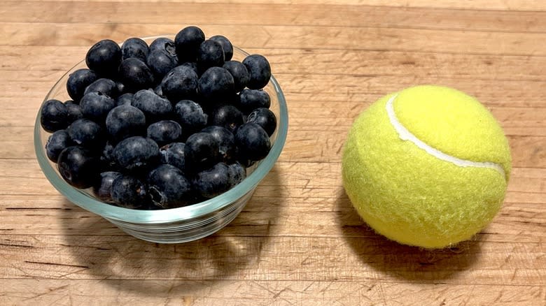 Blueberries and tennis ball