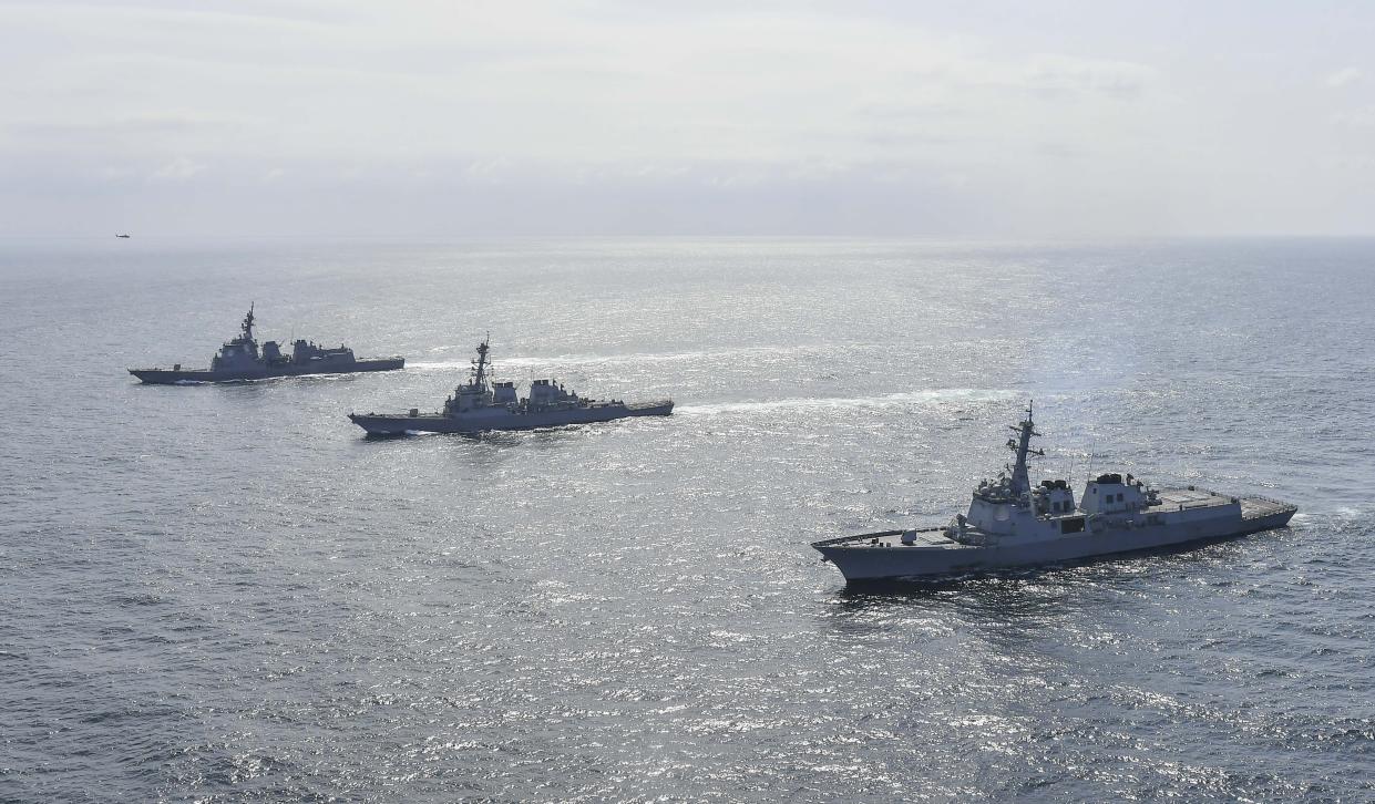 In this photo provided by South Korea Defense Ministry, South Korean Navy's destroyer Yulgok Yi I, right bottom, U.S. Navy's the guided missile destroyer USS Benfold and Japan Maritime Self-Defense Force's destroyer Atago, left top, sail during a joint missile defense drill between South Korea, the United States and Japan in waters off South Korea's east coast, Monday, April 17, 2023. The United States, South Korea and Japan will conduct a joint missile defense exercise Monday in waters near the Korean Peninsula as they expand military training to counter the growing threats of North Korea's nuclear-capable missiles, the South Korean navy said. (South Korea Defense Ministry via AP)