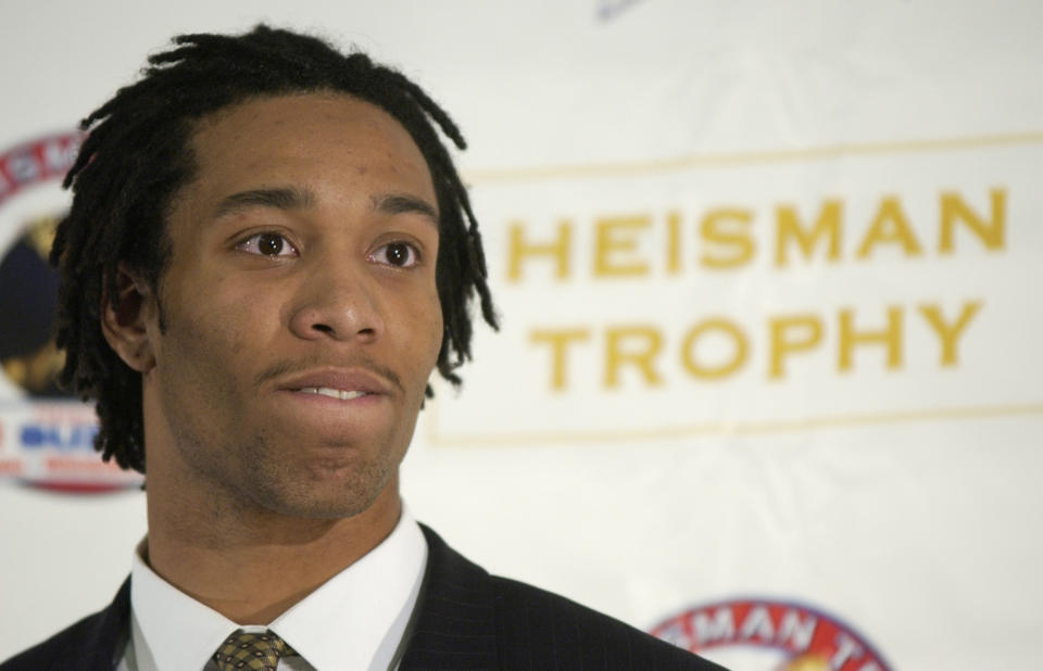 FILE - Heisman Trophy finalist Larry Fitzgerald, a wide receiver from Pittsburgh, talks to the press after Jason White of Oklahoma was named the 2003 Heisman Trophy winner at the Yale Club in New York Saturday, Dec. 13, 2003. Randy Moss and Fitzgerald were among 19 players and three coaches in the latest College Football Hall of Fame class announced Monday, Jan. 8, 2024. (AP Photo/Kathy Willens, File)