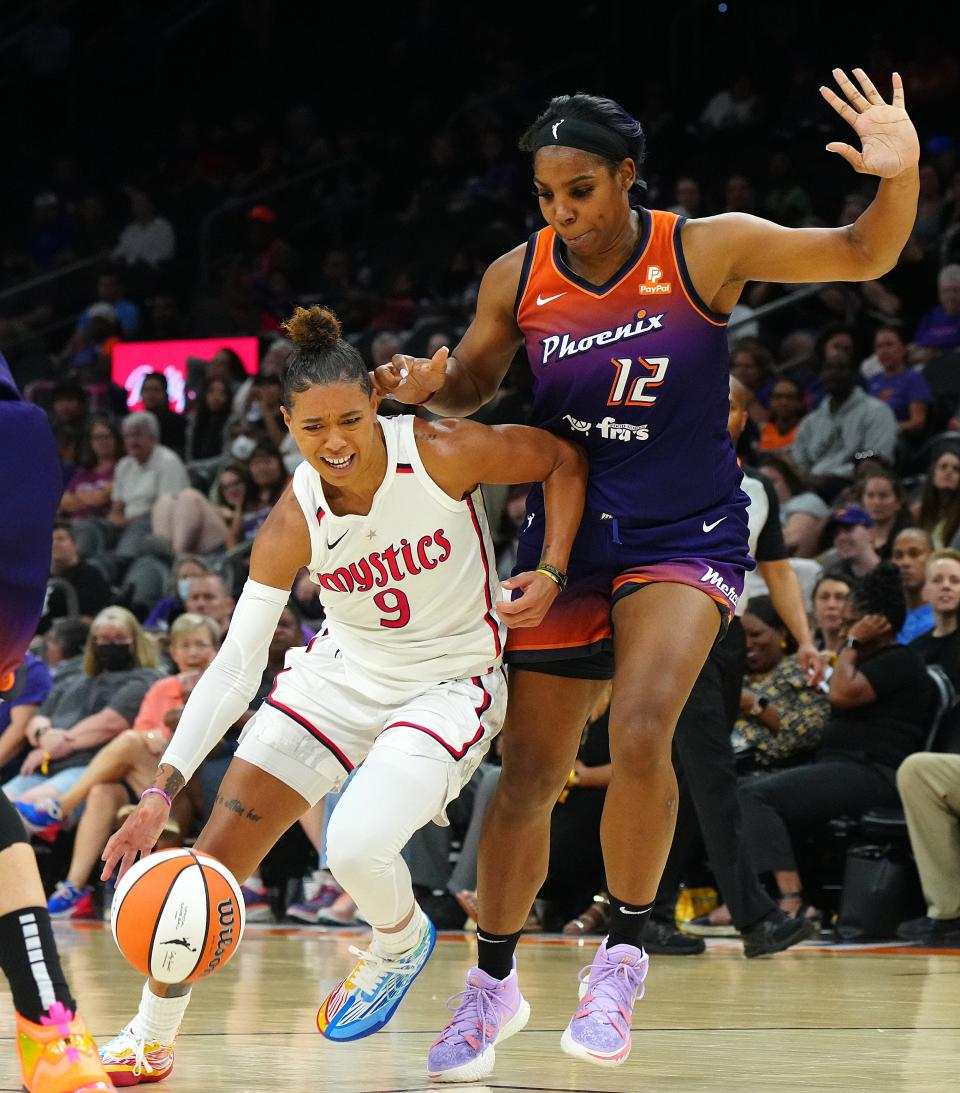 July 14, 2022;  Phoenix, Arizona; USA; Mercury forward Reshanda Gray (12) defends Mystics guard Natasha Cloud (9) during a game at the Footprint Center.