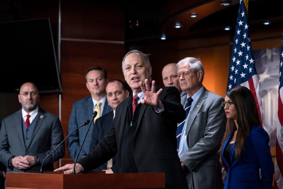 Rep. Andy Biggs, R-Ariz., center, speaks as members of the House Freedom Caucus hold a news conference at the Capitol in Washington, Friday, March 10, 2023. From left are Rep. Clay Higgins, R-La., Rep. Michael Cloud, R-Fla., Rep. Bob Good, R-Va., Rep. Andy Biggs, R-Ariz., Rep. Chip Roy, R-Texas, Rep. Ralph Norman, R-S.C., and Rep. Lauren Boebert, R-Colo.