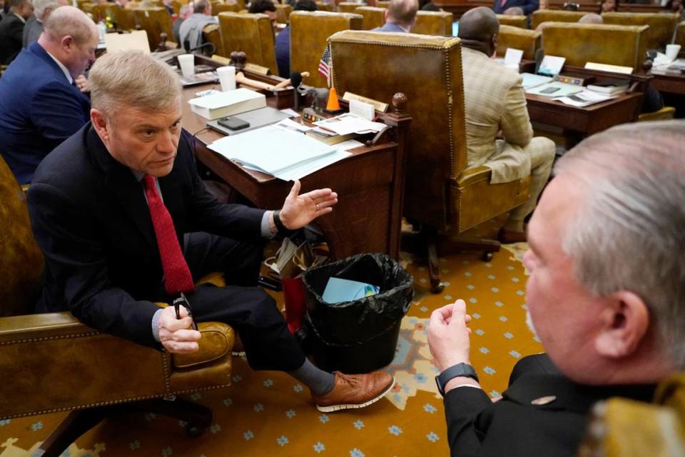 State Reps. Lester Carpenter, R-Burnsville, left, and William Tracy Arnold, R-Booneville, confer prior to Mississippi House Appropriations A Committee Vice Chair Angela Cockerham, I-Magnolia presenting legislation on Project Atlas. Rogelio V. Solis/AP