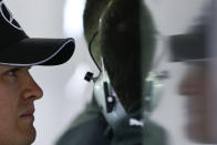 Mercedes driver Nico Rosberg of Germany waits in the garage during the practice session ahead of Sunday's Chinese Formula One Grand Prix at Shanghai International Circuit in Shanghai, China, Saturday, April 19, 2014. (AP Photo/Alexander F. Yuan)