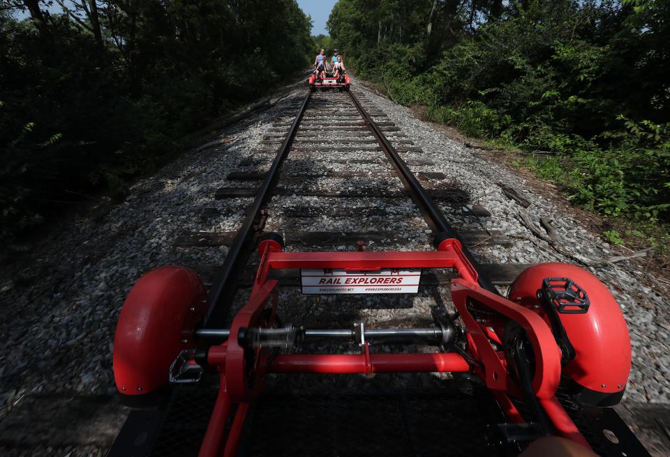 Riders were treated to a 10-mile round-trip scenic view of bourbon distilleries and horse farms aboard Rail Explorers railbikes in Versailles, Ky. on July 27, 2023.  
