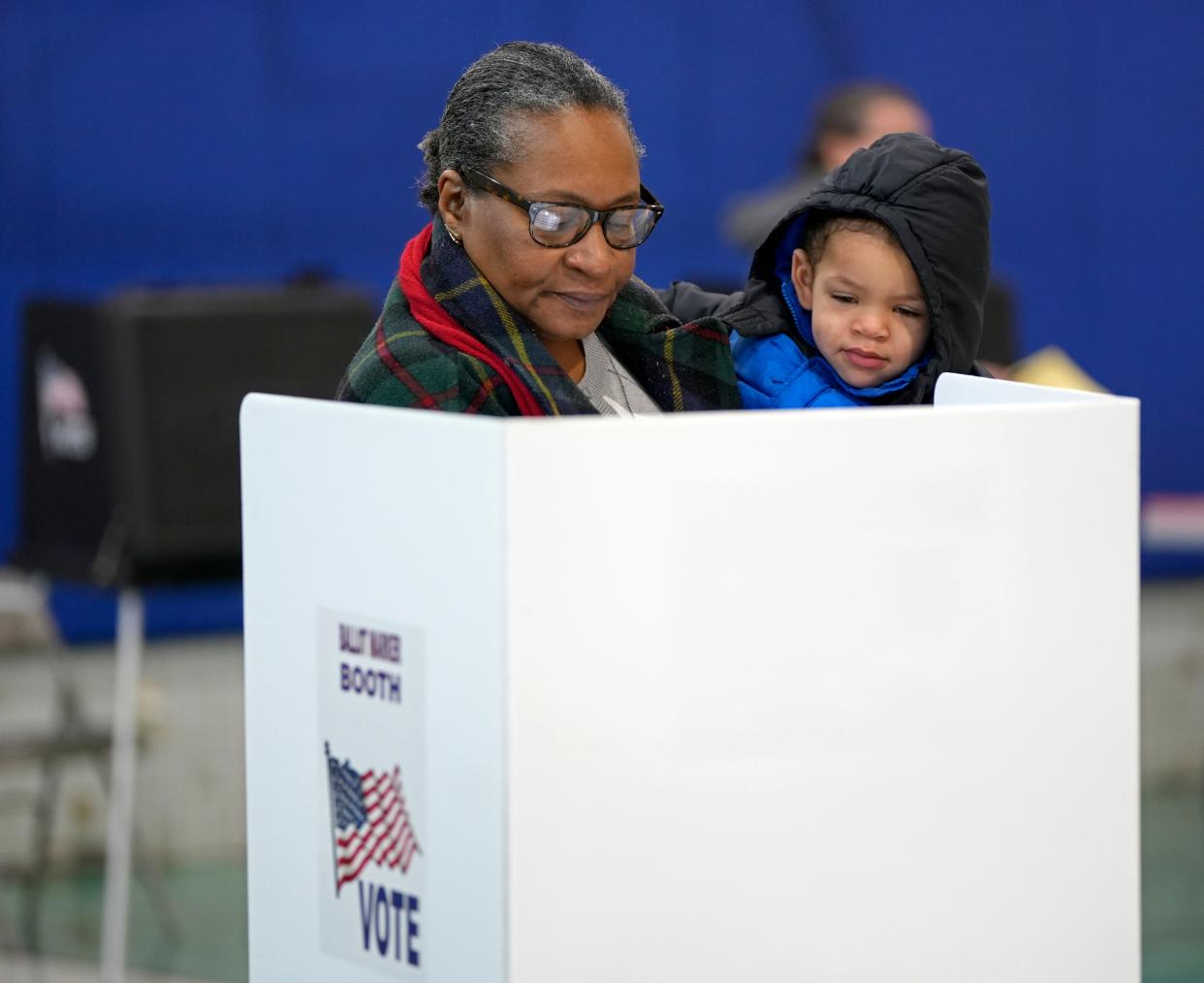 March 19, 2024; Bexley, Ohio, USA; 
Logan Anderson, 2, is held by his grandmother Patricia Rollins of Berwick at All Saints Academy on Election Day on Tuesday. Rollins has taken all four of her grandchildren as well as her adult children when they were young, to the polls with on Election Days.