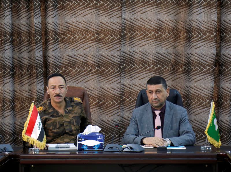 Najm al-Jabouri speaks alongside Mansour Mareid during a meeting in the command operation of Mosul