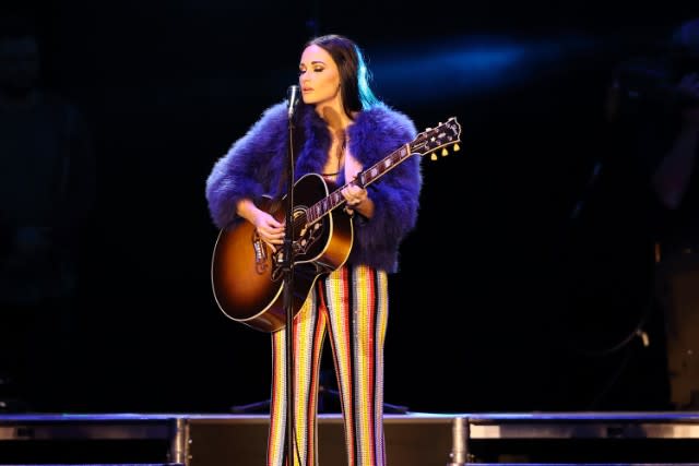 On a dreary afternoon in late March, Kacey Musgraves pulls up to a Walgreens in the town of Sioux City, which sits at the intersection of South Dakota, Nebraska, and Iowa, tucked just inside the border of the latter. She’s here supporting country behemoths Little Big Town on a tour that is approaching the end of a run…