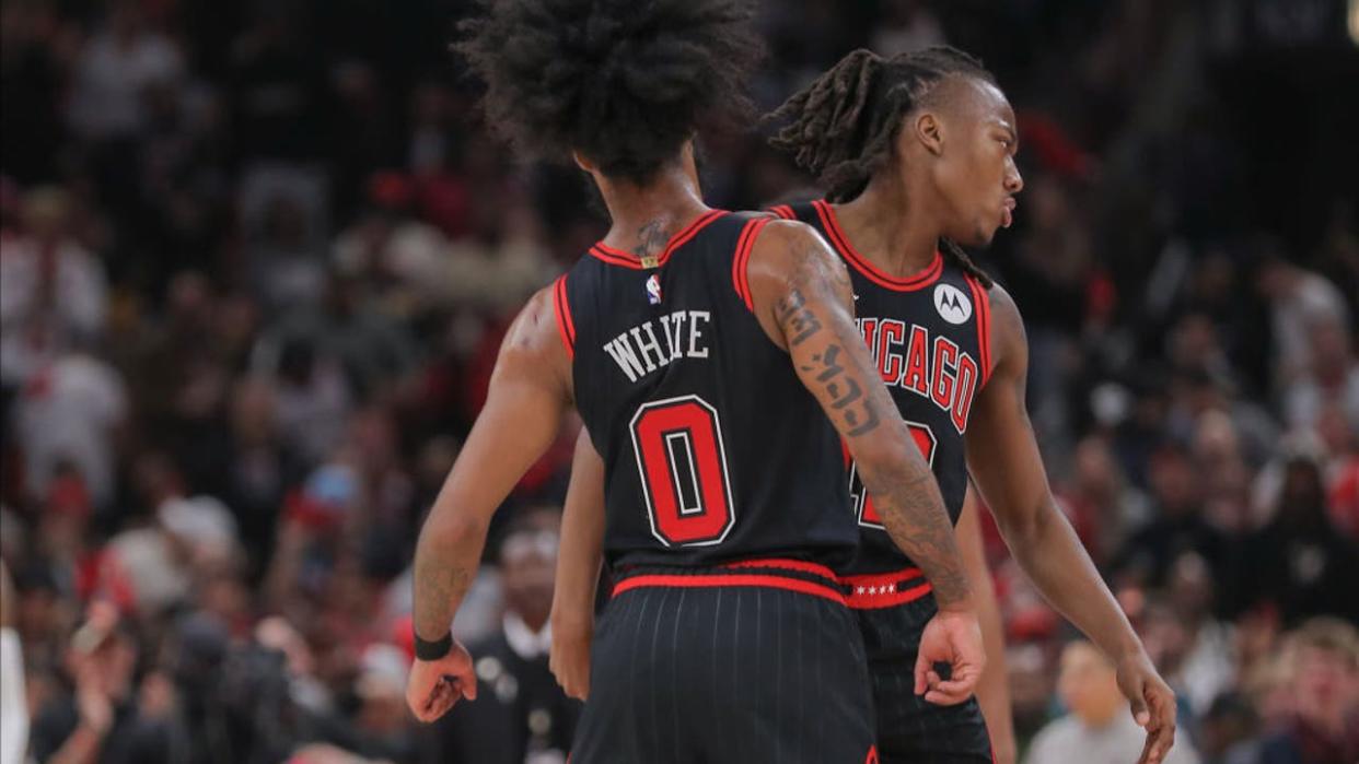 <div>CHICAGO, IL - APRIL 17: Coby White #0 of the Chicago Bulls and Ayo Dosunmu #12 of the Chicago Bulls react after a timeout during first half of the 2024 Play-In Tournament against the Atlanta Hawks at the United Center on April 17, 2024 in Chicago, Illinois. (Photo by Melissa Tamez/Icon Sportswire via Getty Images)</div>