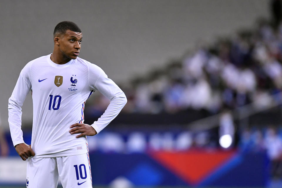 Kylian Mbappe in a white France kit