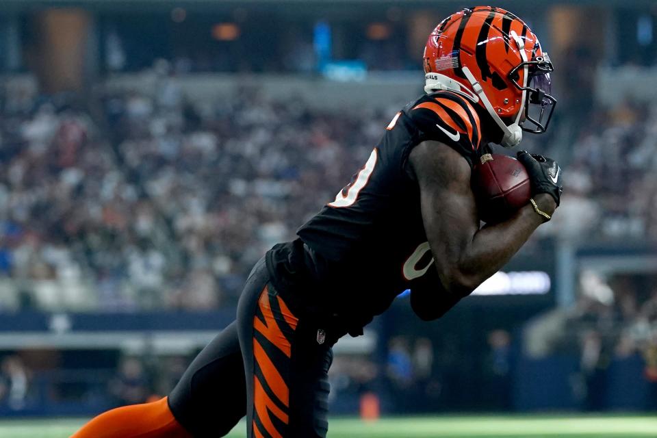 Cincinnati Bengals wide receiver Tee Higgins (85) completes a catch in the fourth quarter of an NFL Week 2 game against the Dallas Cowboys, Sunday, Sept. 18, 2022, at AT&T Stadium in Arlington, Texas. The Dallas Cowboys won, 20-17.