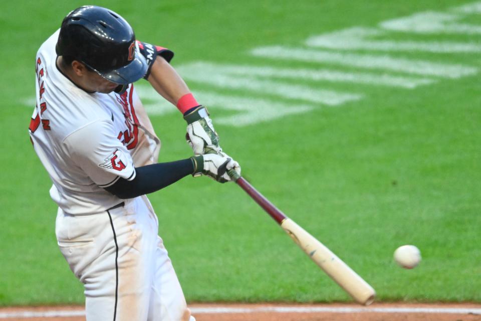 Cleveland Guardians center fielder Tyler Freeman (2) hits a two-run single in the seventh inning Saturday against the Minnesota Twins in Cleveland.