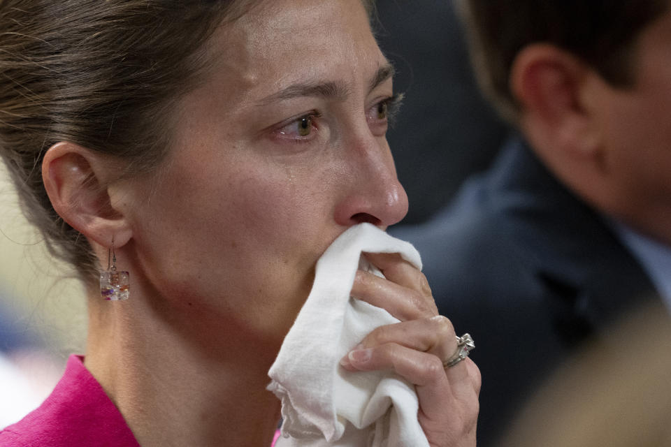 Rebecca Milner, a plaintiff in the Nicole Blackmon vs. the State of Tennessee, wipes away tears as she listens to arguments presented by her attorney in court, Thursday, April 4, 2024, in Nashville, Tenn. The case challenges the medical necessity exception to Tennessee's total abortion ban. (AP Photo/George Walker IV)