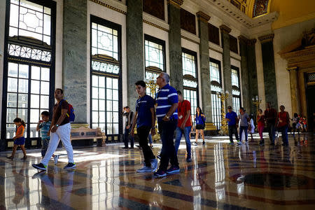 Tourists visit the Capitol in Havana, Cuba, April 17, 2018. REUTERS/Alexandre Meneghini