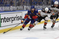 Anaheim Ducks' Rickard Rakell (67) pressures St. Louis Blues' Justin Faulk (72) during the first period of an NHL hockey game on Wednesday, May 5, 2021, in St. Louis. (AP Photo/Joe Puetz)