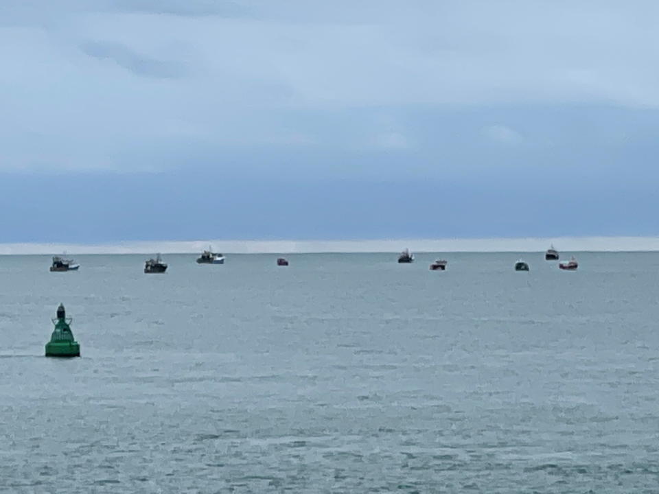 Boats are seen in the only channel that allows access to the harbour, in St Helier, Jersey. Source: Reuters