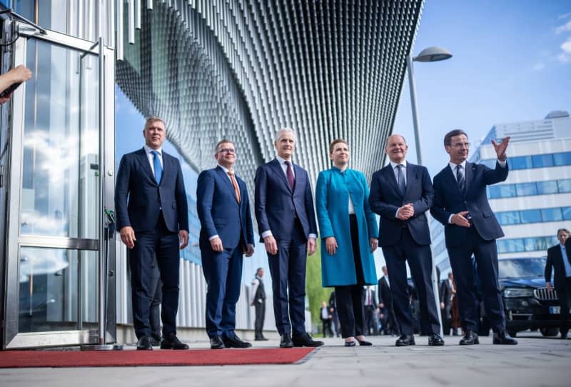 (L-R) Bjarni Benediktsson, Prime Minister of Iceland, Petteri Orpo, Prime Minister of Finland, Jonas Gahr Store, Prime Minister of Norway, Mette Frederiksen, Prime Minister of Denmark, German Chancellor Olaf Scholz, and Ulf Kristersson, Prime Minister of Sweden, stand together for a group photo at the Nordic Council meeting in Sweden. Michael Kappeler/dpa