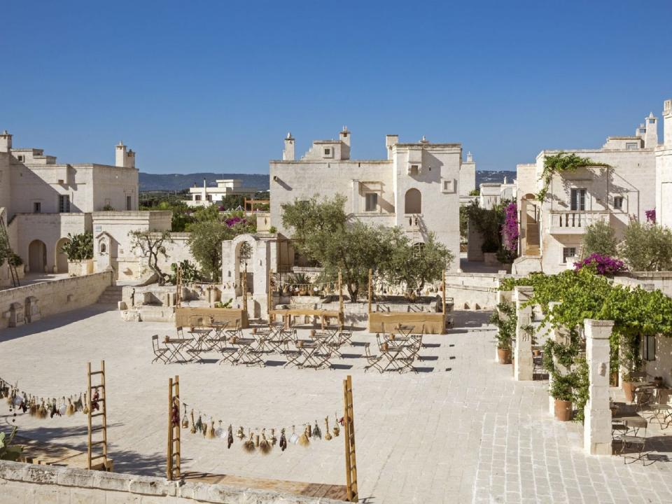 A traditional village square hosts a weekly fiesta with cooking demos and live entertainment (Borgo Egnazia)