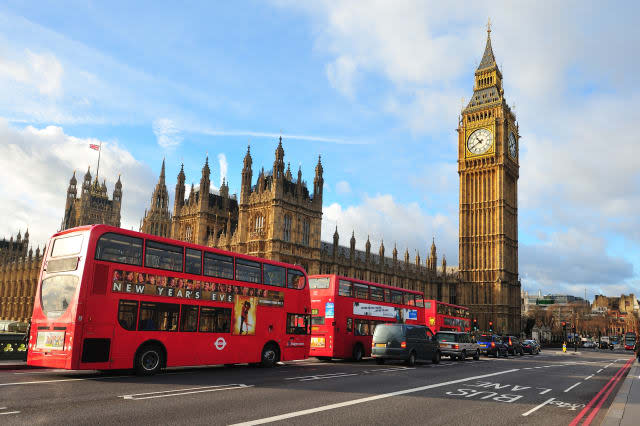 LONDON - JAN 21: London Buses with Big Ben on January 21, 2012 in London, England. The London Bus service is one of the largest