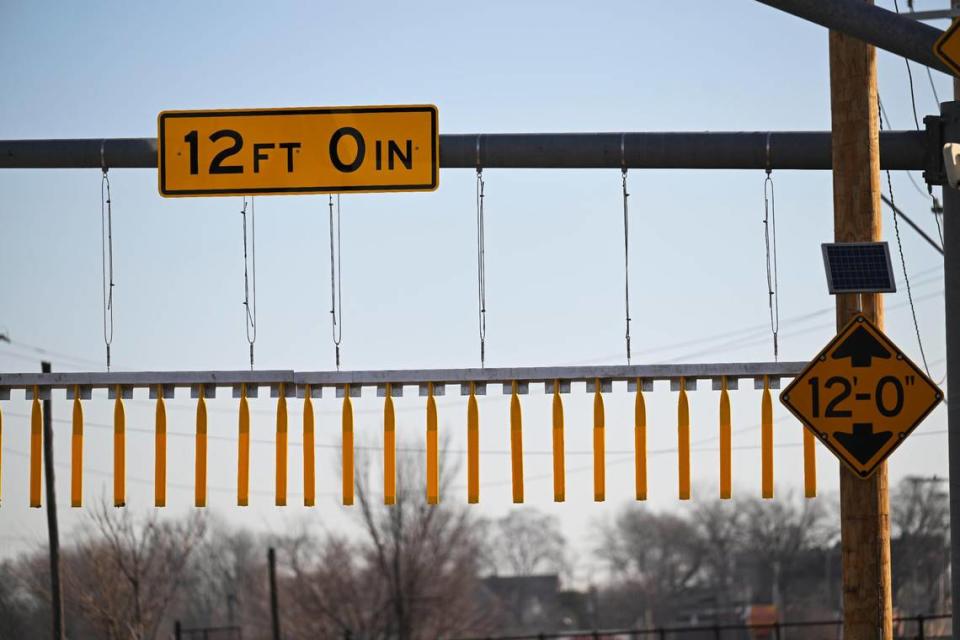 The Independence Avenue railroad bridge between Wilson Avenue and White Avenue is known for damaging trucks as they attempt to pass under the 12-foot high bridge. A bridge curtain, seen here on Friday, Feb. 2, 2024, was just installed to warn truck drivers of the low height before they reach the bridge.