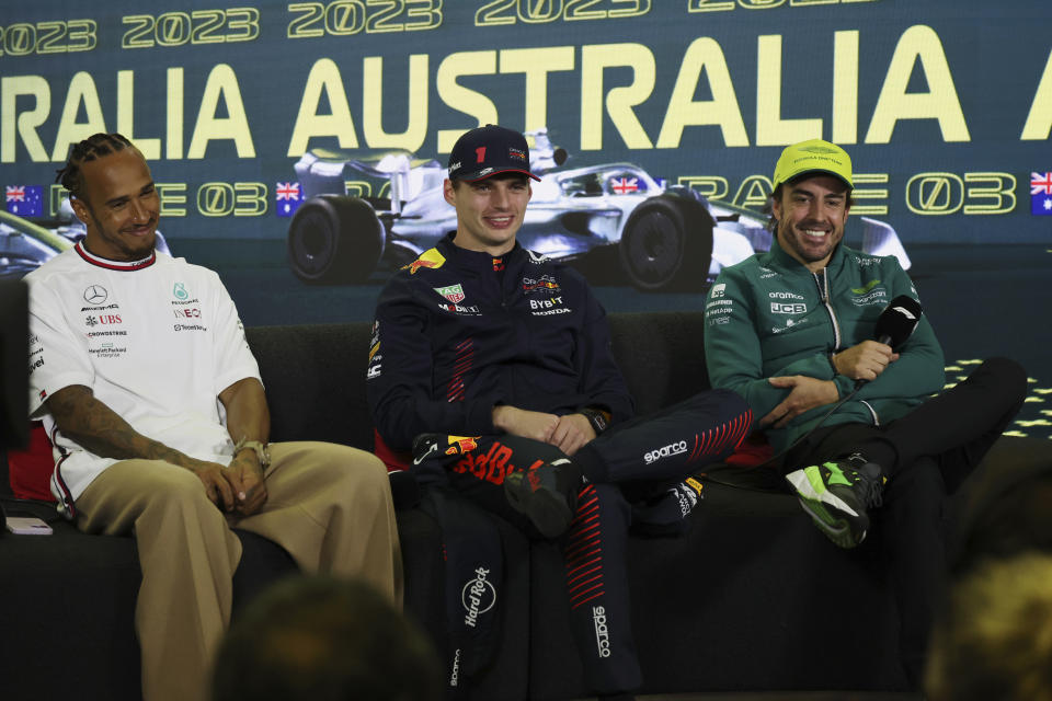 Mercedes driver Lewis Hamilton of Britain, left, Red Bull driver Max Verstappen of Netherlands, and Aston Martin driver Fernando Alonso of Spain, right, attend a post-race press conference after the Australian Formula One Grand Prix at Albert Park in Melbourne, Sunday, April 2, 2023. Verstappen won the race while Hamilton came 2nd and Alonso took 3rd. (AP Photo/Asanka Brendon Ratnayake)