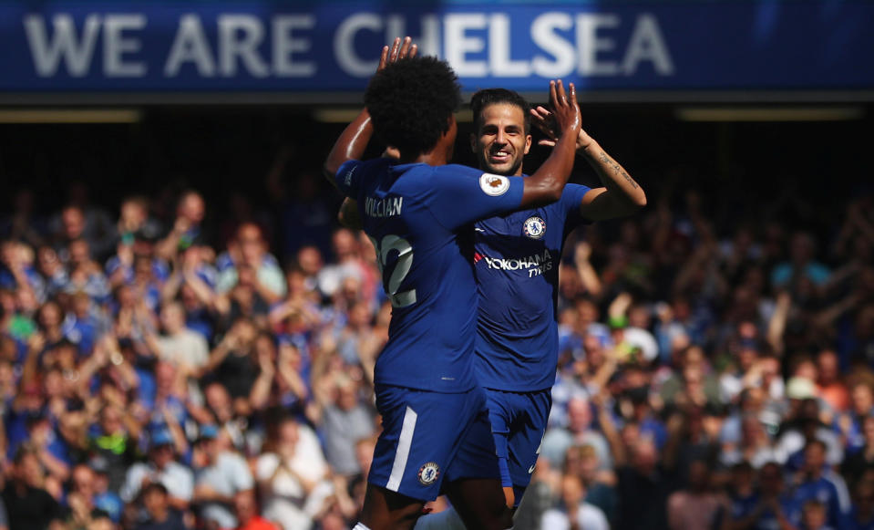 Chelsea’s Cesc Fabregas celebrates scoring their first goal with Willian REUTERS/Hannah McKay
