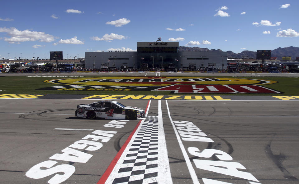 Kevin Harvick passes the start/finish line during a NASCAR Cup series auto race Sunday, March 4, 2018, in Las Vegas. (AP Photo/Isaac Brekken)