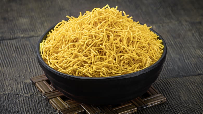 Black bowl of sev