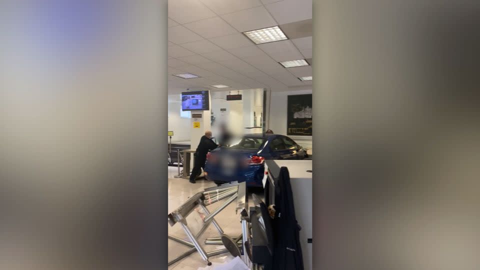 A car that crashed into the lobby of the Chinese consulate in San Francisco is seen on Monday. CNN has blurred portions of this image to protect individuals' privacy. - Courtesy Sergii Molchanov