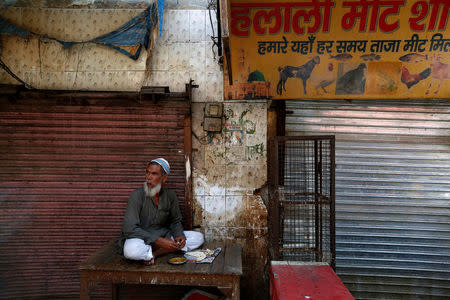 A muslim meat shop owner looks on outside his closed shop in Gurugram, Haryana, India March 29, 2017. REUTERS/Cathal McNaughton
