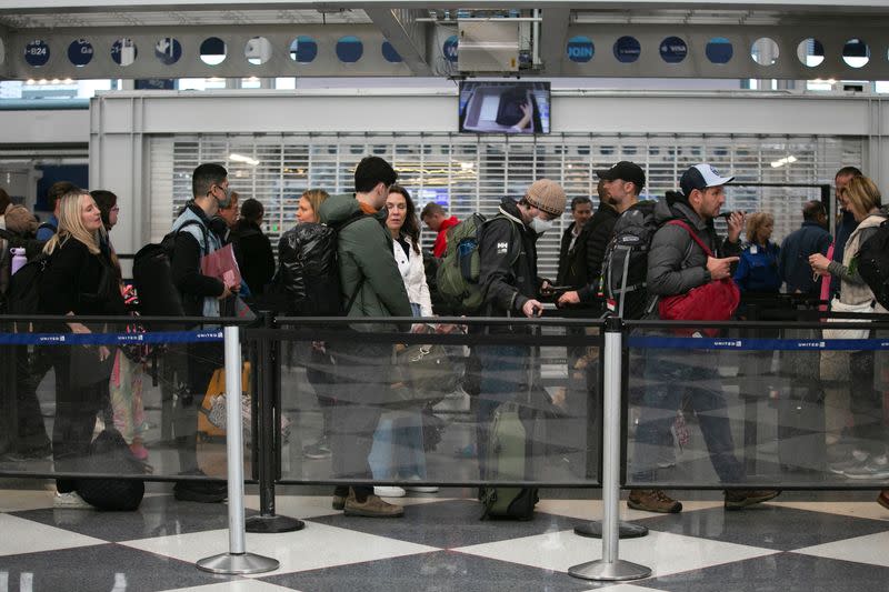 Passengers wait for the resumption of flights at O'Hare International Airport