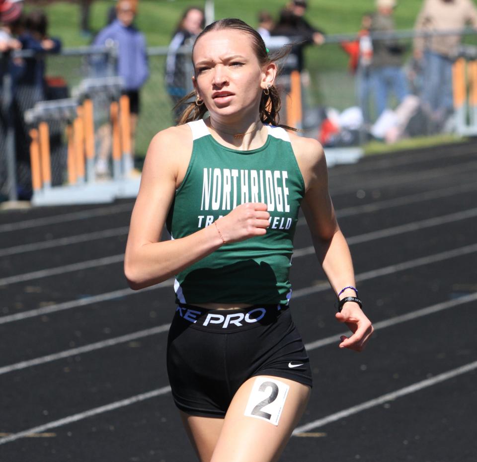 Northridge's Sarah Koker runs the 800 during Heath's Hank Smith Invitational on Saturday.