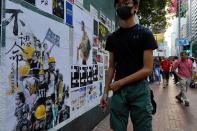 Pedestrian walk past a newly created Lennon Wall in Hong Kong, Saturday, Sept. 28, 2019. Hong Kong activists first created their own Lennon Wall during the 2014 protests, covering a wall with a vibrant Post-it notes calling for democratic reform. Five years later, protestors have gathered to create impromptu Lennon Walls across Hong Kong island. (AP Photo/Vincent Yu)