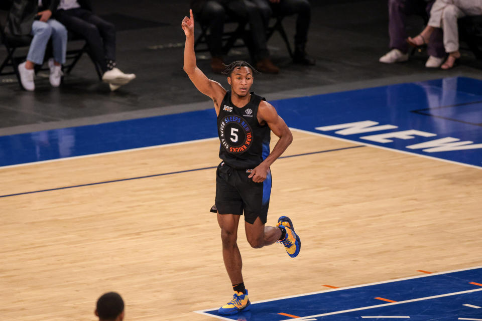 Immanuel Quickley points up in reaction to making a bucket.