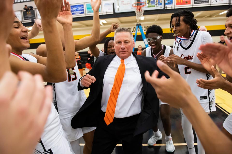 Central York head coach Jeff Hoke dances for his players including Byron Pinkney (back right) after the Panthers won YAIAA boys' basketball championship against York Suburban Friday, Feb. 16, 2024, at Red Lion Area High School. The Panthers defeated the Trojans, 63-45.