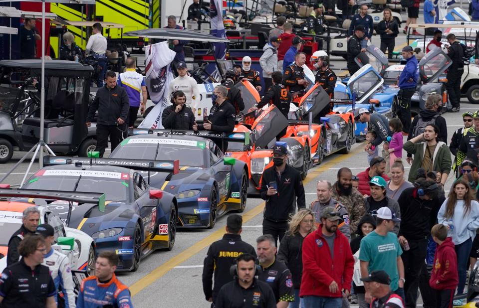 A familiar January scene at Daytona International Speedway, with a wide variety of international racing machinery and  fans who love looking at it.