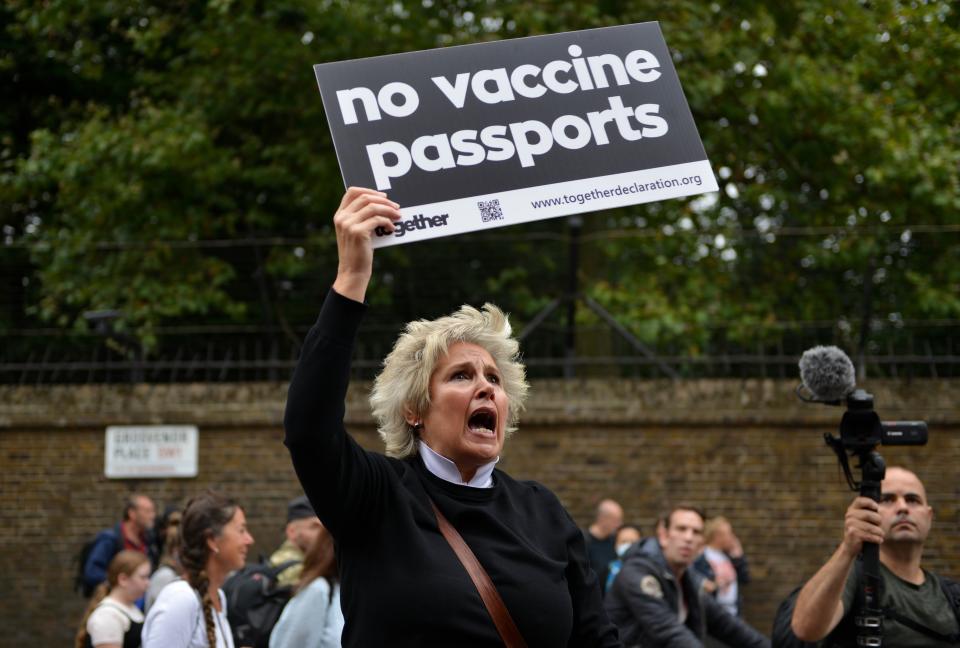 <p>LONDON, UNITED KINGDOM - 2021/09/25: A protester marching with a No Vaccine Passports placard, during the demonstration. Anti-Vaccine and anti-covid 19 passports protesters gathered in Hyde Park and marched through central London. (Photo by Thomas Krych/SOPA Images/LightRocket via Getty Images)</p>
