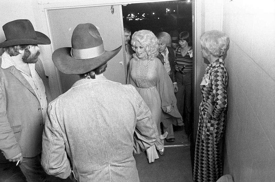 Dec. 2, 1977: Dolly Parton entering Panther Hall in Fort Worth, Texas, with her crew for a concert. There were 1,250 people in the venue’s country music ballroom.