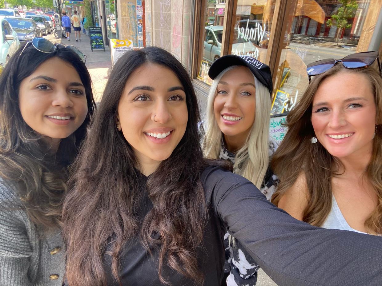 Four women pose in a photo.