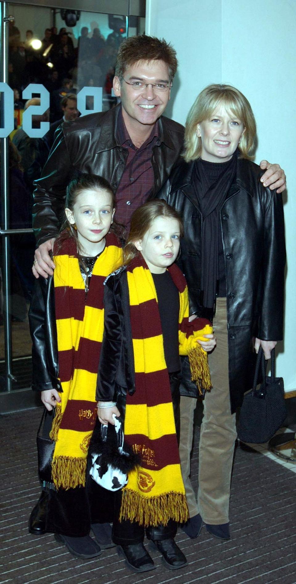 TV presenter Phillip Schofield arrives with his wife Stephanie, and children Ruby (right) and Molly for the celebrity film premiere of Harry Potter and the Chamber of Secrets at the Odeon Leicester Square in London's West End.