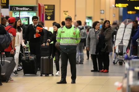 Police patrol at Jorge Chavez airport in Callao, Peru, August 16, 2018. REUTERS/Mariana Bazo