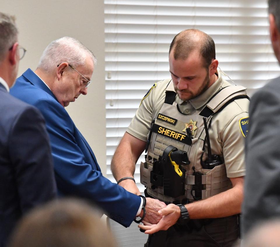 A Wichita County deputy handcuffs Ronnie Allen Killingsworth, pastor of Rephidim Church in Wichita Falls, on Tuesday in 30th District Court. A jury convicted Killingsworth, 79, on six counts of Indecency with a child for the sexual abuse of three girls in his church. A jury will determine Killingsworth's punishment Wednesday.
