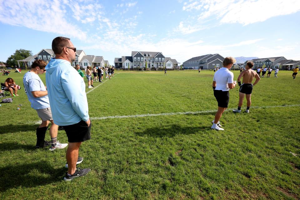Mike Wilson watches as his son Isaac Wilson walks back out onto the field during a 7-on-7 passing league game in Layton on Friday, June 9, 2023. | Scott G Winterton, Deseret News