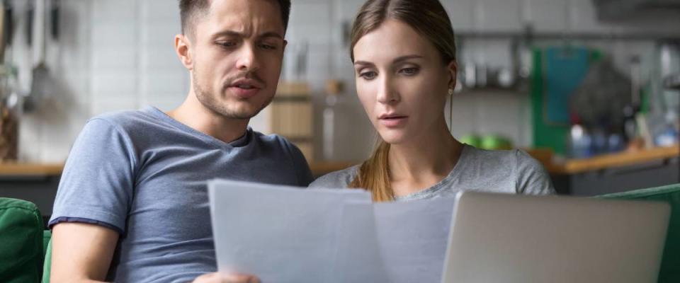 Couple comparing credit histories