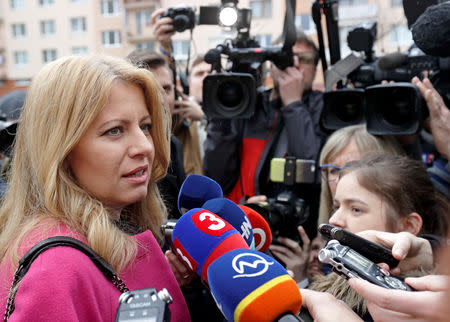 FILE PHOTO: Slovakia's presidential candidate Zuzana Caputova speaks to media after casting her vote during the country's presidential elections at a polling station in Pezinok, Slovakia, March 16, 2019. REUTERS/David W Cerny/File Photo