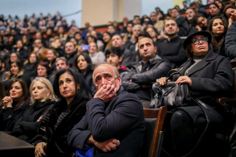 Mourners attend a memorial for the victims of a Ukrainian passenger plane which was shot down in Iran