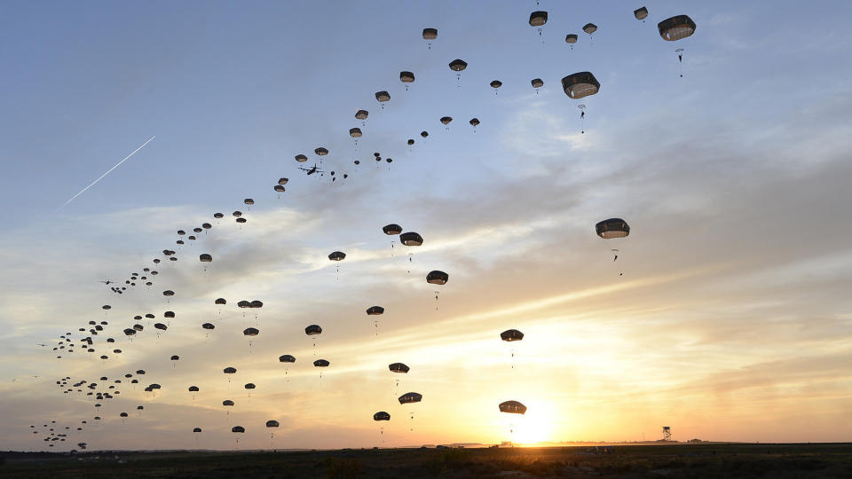 C-130J Super Hercules aircraft assigned to the 317th Airlift Group, Dyess Air Force Base, Texas, help U.S. Army and British paratroopers perform a static line jump at Holland Drop Zone in preparation for Combined Joint Operational Access Exercise 15-01 at Fort Bragg, North Carolina on April 11, 2015. This is the largest exercise of its kind held at Fort Bragg in nearly 20 years and demonstrates interoperability between U.S. Army and British army soldiers, U.S. Air Force, Air National Guard and Royal Air Force airmen and U.S. Marines.