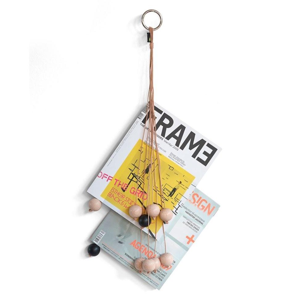 SHOP NOW: Hang Out Magazine Holder by Wirth, $53, royaldesign.com
