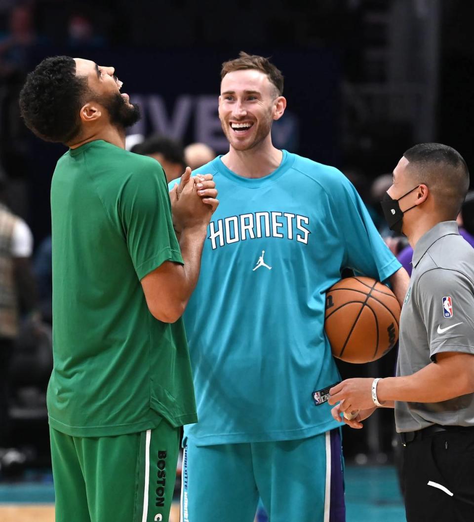 Boston Celtics forward/guard Jayson Tatum, left and Charlotte Hornets forward Gordon Hayward, right, joke with one another prior to the teams’ game Monday. Hayward used to play for the Celtics. Tatum had a game-high 41 points Monday.