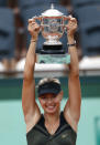 Russia's Maria Sharapova holds a trophy on the podium after winning against Italy's Sara Errani their Women's Singles final tennis match of the French Open tennis tournament at the Roland Garros stadium, on June 9, 2012 in Paris. AFP PHOTO / THOMAS COEXTHOMAS COEX/AFP/GettyImages